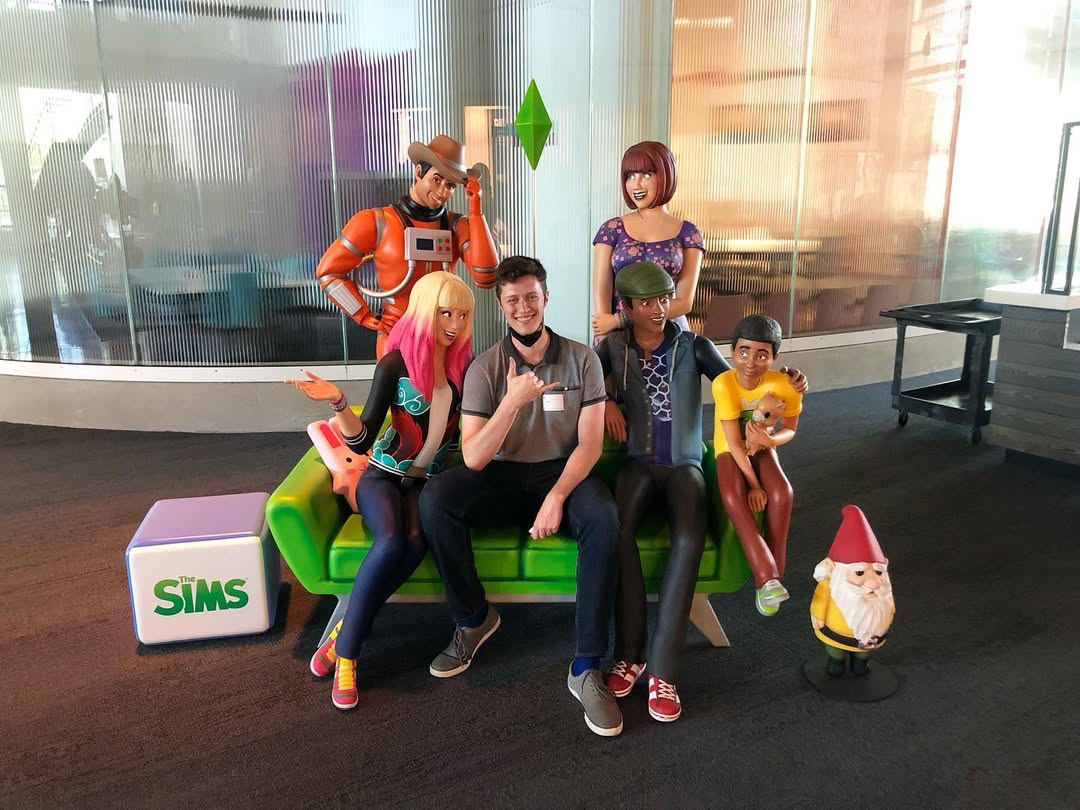David Barrett at EA Maxis with Sims character statues